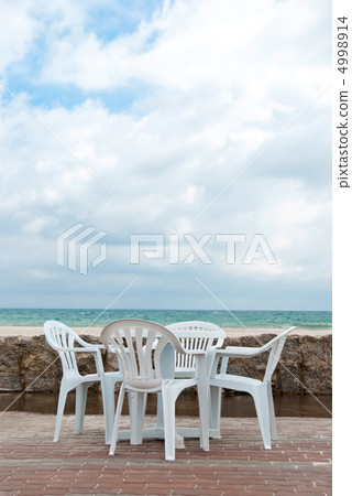 Table near sea Table near sea 4998914