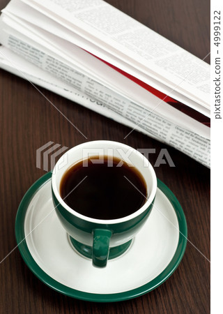 Coffee and newspaper Coffee and newspaper 4999122