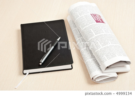 Notebook and newspaper Notebook and newspaper 4999134