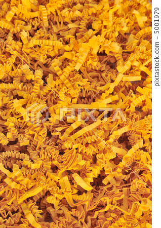 Detail of orange shredded packaging paper - background. 5001979
