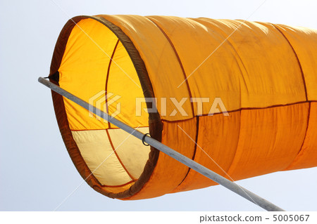 Wind direction Flag on blue cloud sky in wind Wind direction Flag on blue cloud sky in wind 5005067