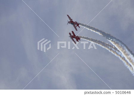 Two planes performing in an air show Two planes performing in an air show 5010646