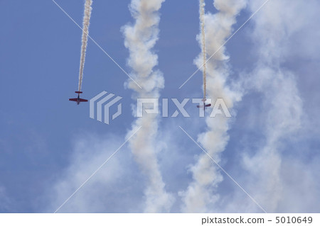Two planes performing in an air show Two planes performing in an air show 5010649