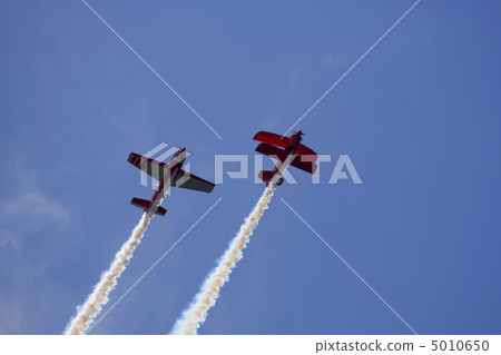 Two planes performing in an air show Two planes performing in an air show 5010650