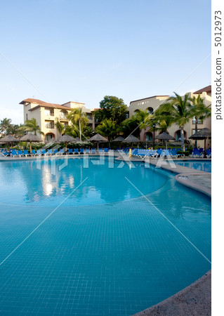 Beautiful pool and patio in tropical setting Beautiful pool and patio in tropical setting 5012973