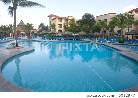 Beautiful pool and patio in tropical setting Beautiful pool and patio in tropical setting 5012977