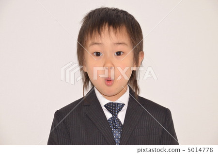 Boys wearing a suit and looking at the camera 5014778