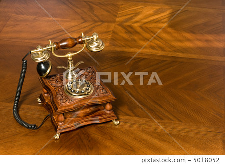 Old-fashioned telephone on table 5018052