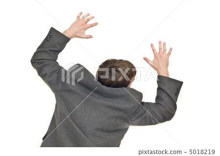 Back view of businessman climbing the wall 5018219