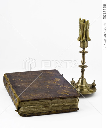 Candlestick and a book 5018366