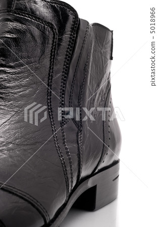 Closeup of Black leather mens boot 5018966