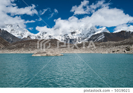 Clouds and Sacred Lake near Gokyo in Himalayas Clouds and Sacred Lake near Gokyo in Himalayas 5019021