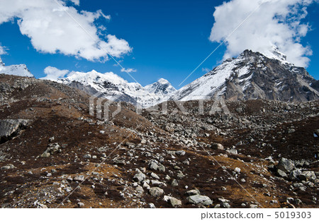 Peaks and moraine near Gokyo in Himalayas 5019303