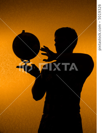 Discover the world - silhouette of man holding globe 5019326