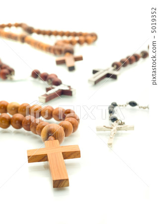 Religion diversity - rosary beads over white 5019352