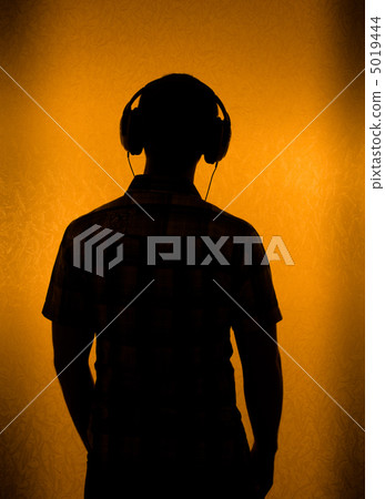 Silhouette of man with headset Silhouette of man with headset 5019444