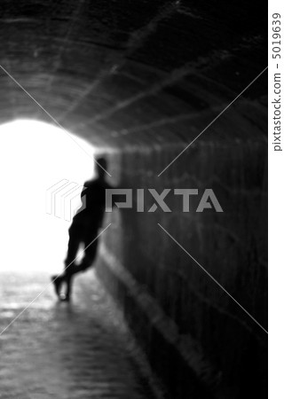 Blurred human silhouette against the light Blurred human silhouette against the light 5019639