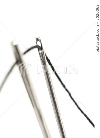 Two needles with thread over white Two needles with thread over white 5020062