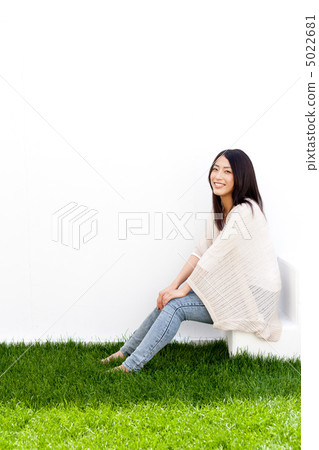Women sitting on the stairs 5022681