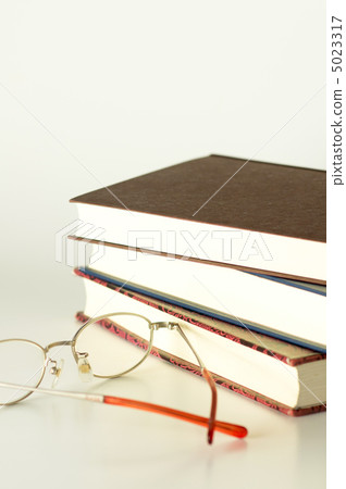Three books and glasses 5023317
