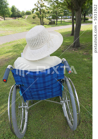 Senior riding a wheelchair 5031922