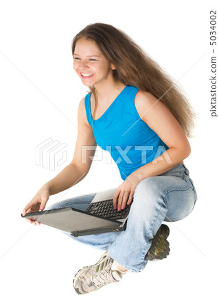 laughing girl with laptop 5034002