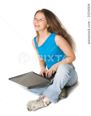girl with laptop sits on the floor girl with laptop sits on the floor 5034004