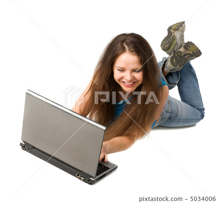girl with laptop lying on floor girl with laptop lying on floor 5034006
