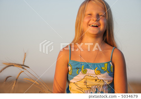 The girl in filed wheats. The girl in filed wheats. 5034679