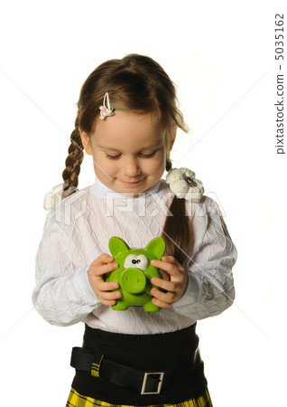 The little girl with a money box - a pig 5035162