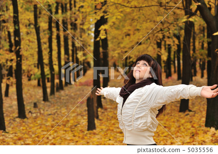 The girl in an autumn forest 5035556
