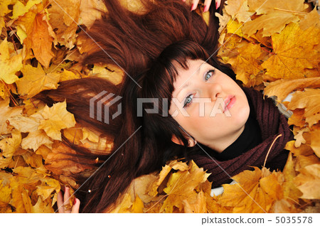The girl in autumn leaves The girl in autumn leaves 5035578