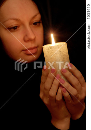 The woman with burning candle 5035630