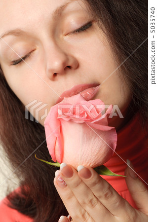 The woman with a rose closeup 5035740