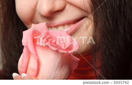 The woman with a rose closeup 5035742
