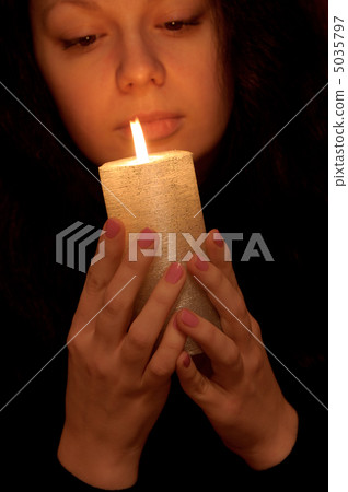 The woman with burning candle 5035797