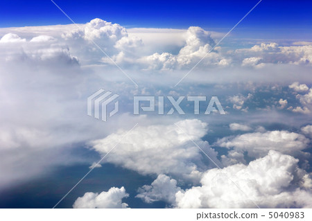 View above the earth at the clouds below. View above the earth at the clouds below. 5040983