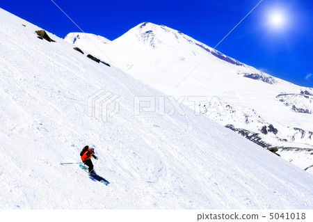 A skier descending Mount Elbrus - the highest peak in Europe. A skier descending Mount Elbrus - the highest peak in Europe. 5041018