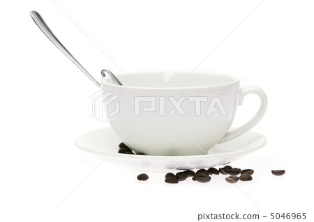 cup and saucer and coffee beans isolated on white 5046965
