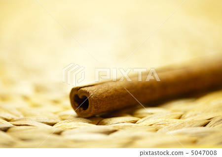 cinnamon sticks on a wicker mat cinnamon sticks on a wicker mat 5047008