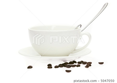 cup and saucer and coffee beans isolated on white 5047050