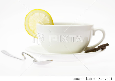 white cup with a lemon isolated on white 5047401