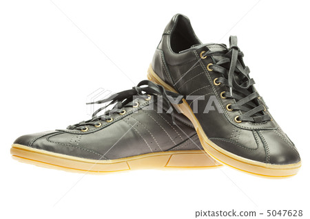 new black sneakers isolated on white new black sneakers isolated on white 5047628