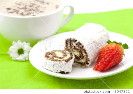 Cappuccino with a sweet roll isolated on white Cappuccino with a sweet roll isolated on white 5047831