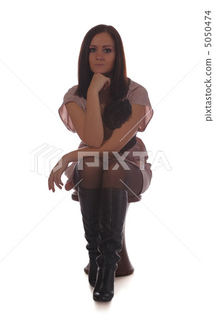 beautiful girl sitting on chair 5050474