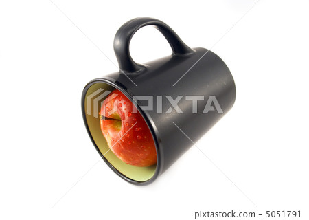 apple in a cup isolated on white 5051791