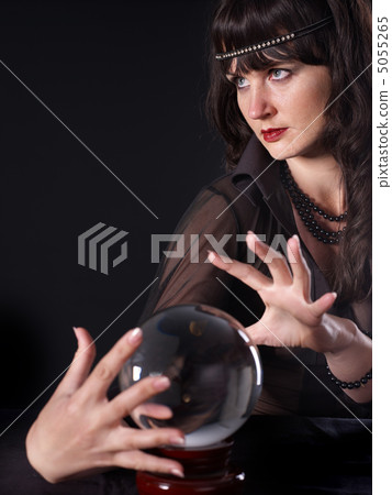 Young woman with crystal ball. Young woman with crystal ball. 5055265