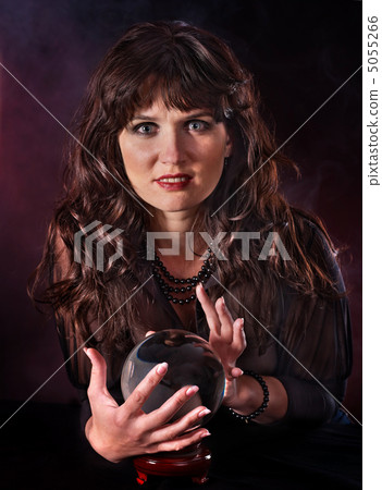 Young woman with crystal ball. Young woman with crystal ball. 5055266
