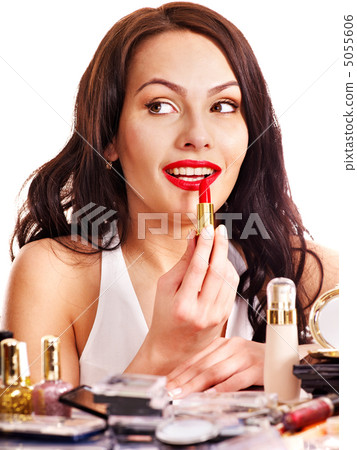 Girl applying makeup. 5055606