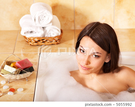 Woman relaxing in bath. Woman relaxing in bath. 5055992